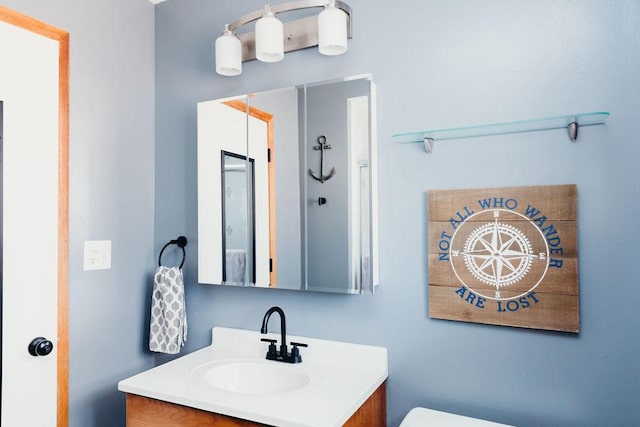 bathroom with vanity and toilet