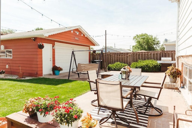 view of patio / terrace with a grill and an outdoor structure