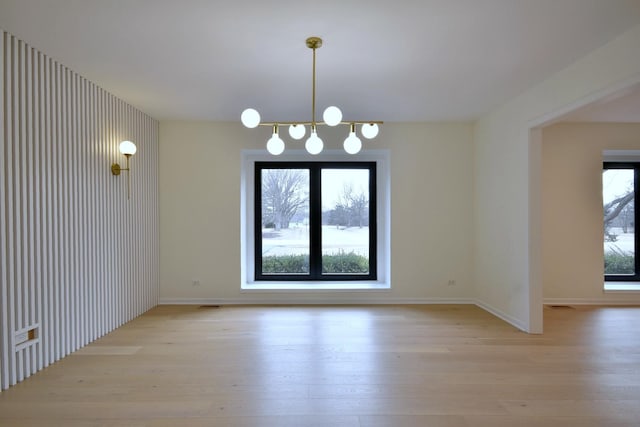 unfurnished dining area featuring light hardwood / wood-style flooring