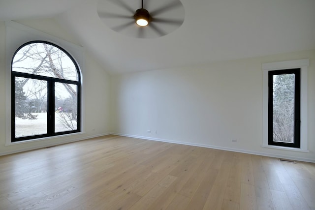 bonus room featuring lofted ceiling, light hardwood / wood-style floors, and ceiling fan