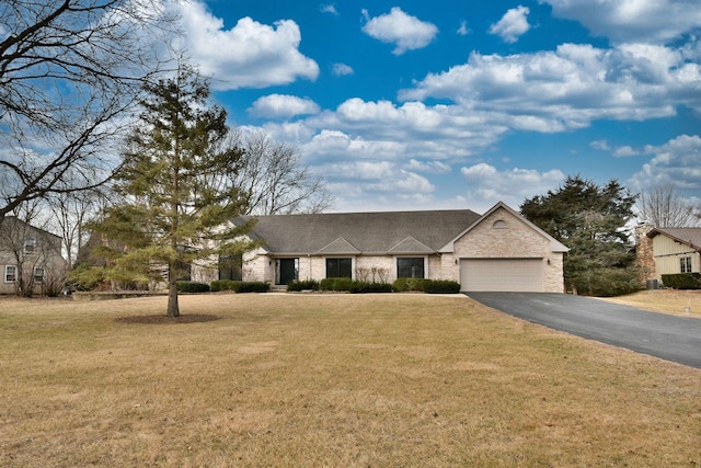 view of front of property with a garage and a front yard