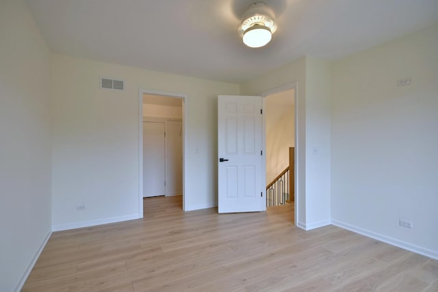 empty room with light hardwood / wood-style floors