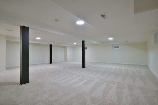 basement featuring light colored carpet