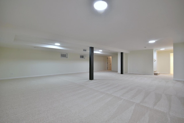 basement featuring light carpet