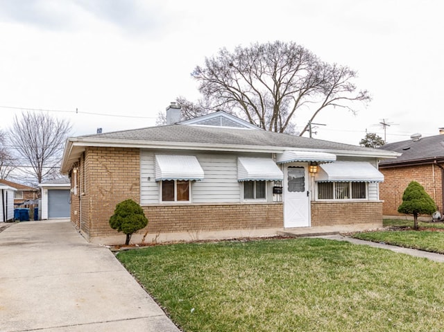 bungalow-style home with brick siding, a chimney, an outdoor structure, and a front yard