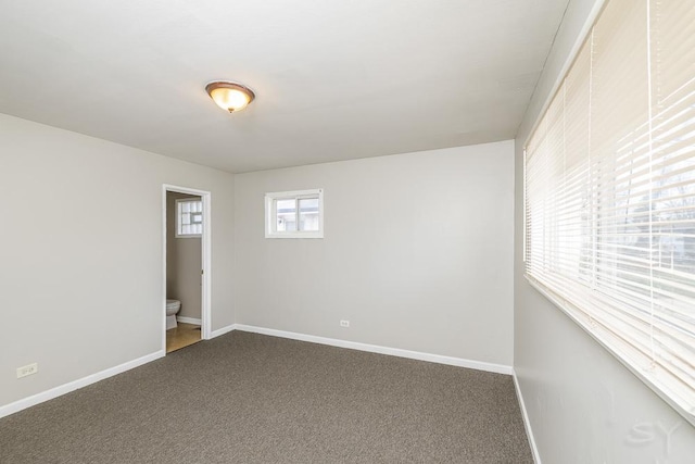 spare room with carpet floors and baseboards