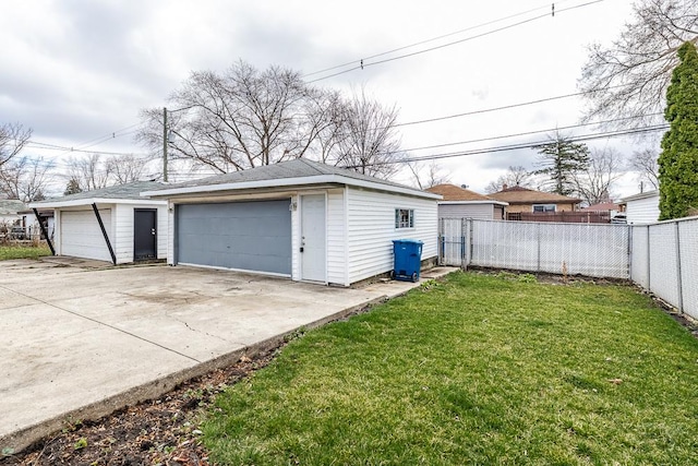 detached garage featuring fence