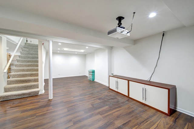 basement featuring dark hardwood / wood-style flooring