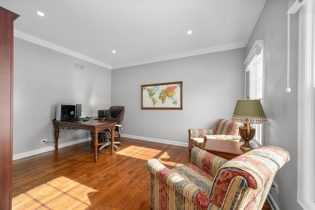 home office featuring light hardwood / wood-style floors and crown molding