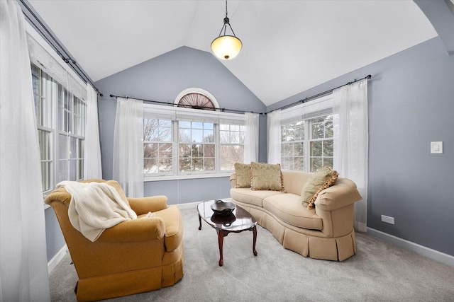 sitting room with vaulted ceiling and carpet