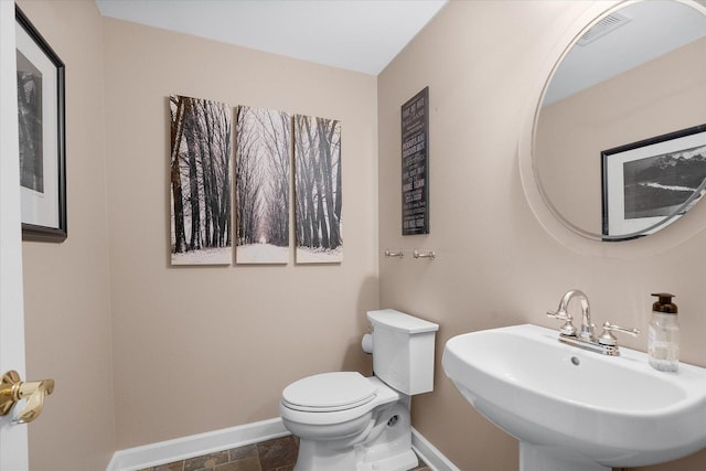 bathroom with sink and toilet