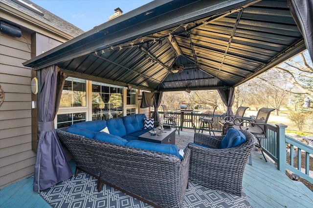 deck with outdoor lounge area and a gazebo