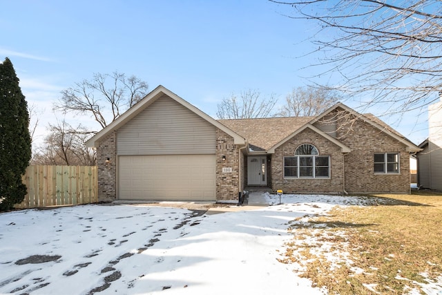 view of front facade with brick siding, an attached garage, and fence