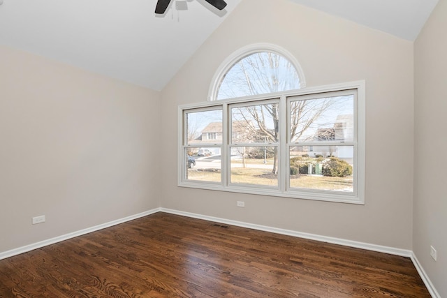 spare room featuring dark wood-type flooring, ceiling fan, and lofted ceiling