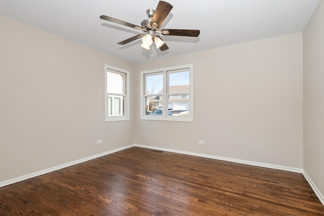 unfurnished room with dark wood-type flooring and ceiling fan