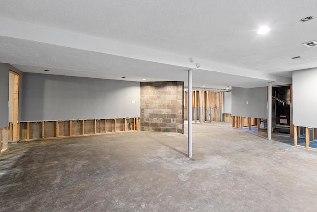 basement with a textured ceiling