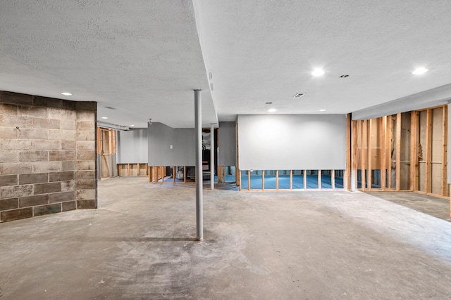 basement with a textured ceiling