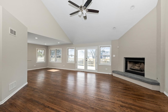 unfurnished living room featuring french doors, ceiling fan, dark hardwood / wood-style flooring, and high vaulted ceiling