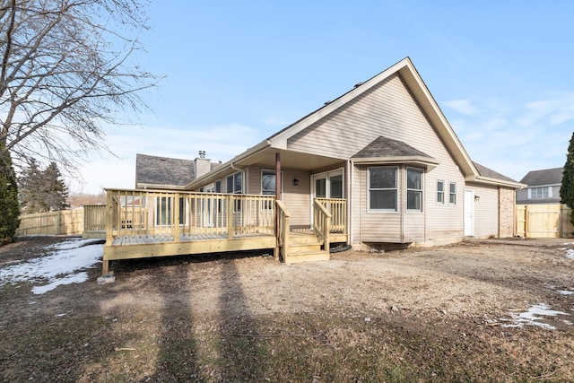 back of house featuring a deck