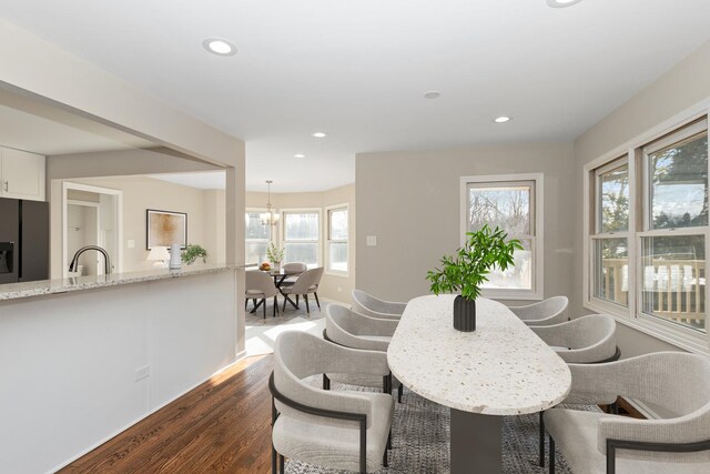 dining area featuring dark wood-style floors, an inviting chandelier, and recessed lighting