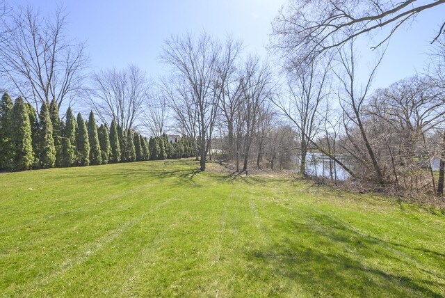 back of property with a chimney, a wooden deck, and fence