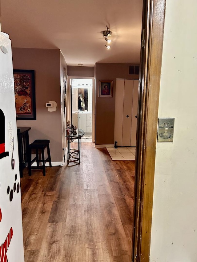 corridor featuring hardwood / wood-style floors