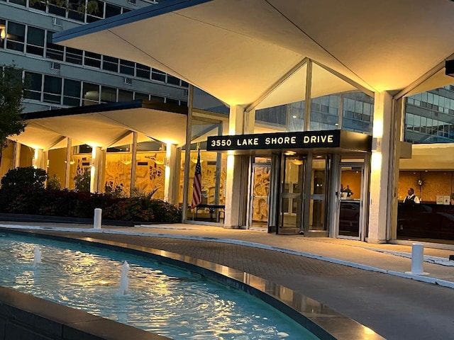 property entrance with a community pool