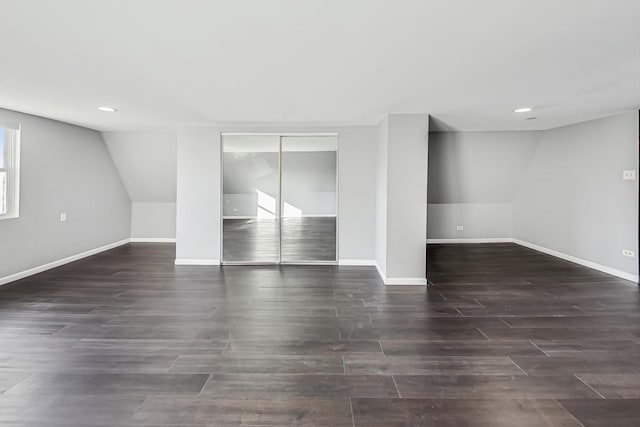 basement with dark hardwood / wood-style floors