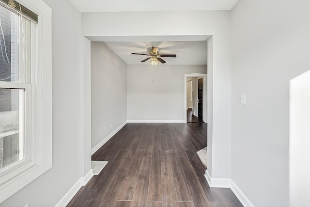 hallway with dark hardwood / wood-style floors