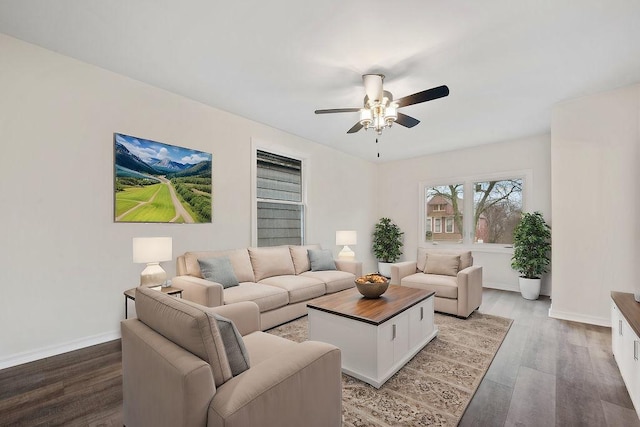 living room with ceiling fan and wood-type flooring