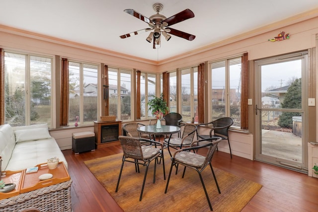 sunroom with a ceiling fan