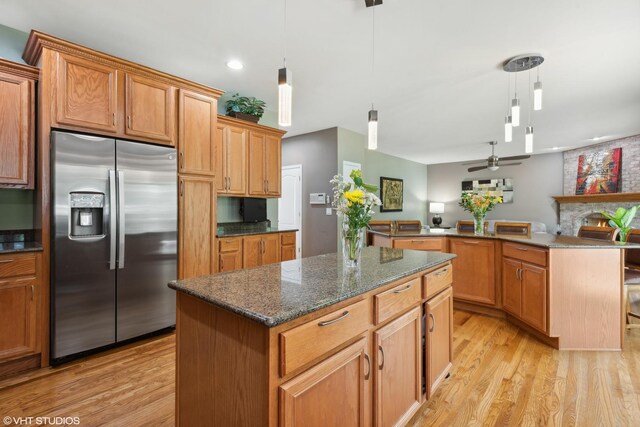 kitchen featuring appliances with stainless steel finishes, sink, a kitchen island, and white cabinets