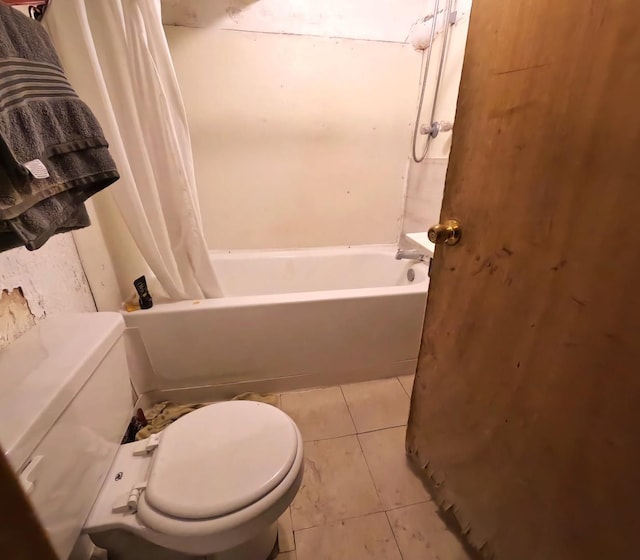 bathroom featuring shower / bathtub combination with curtain, toilet, and tile patterned flooring