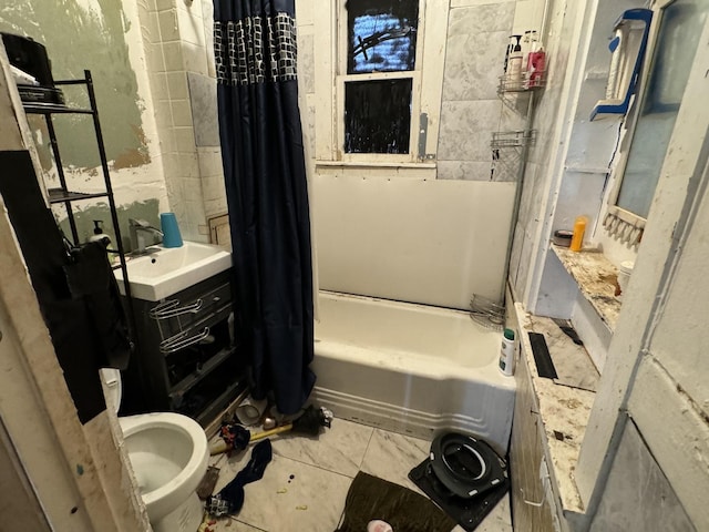 bathroom with shower / tub combo with curtain, sink, and tile patterned floors