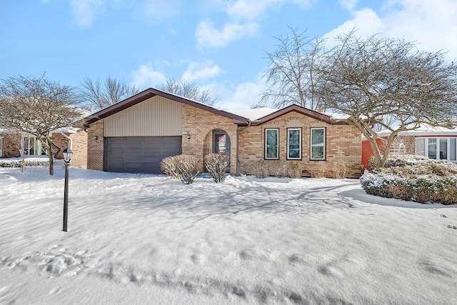 ranch-style house featuring a garage