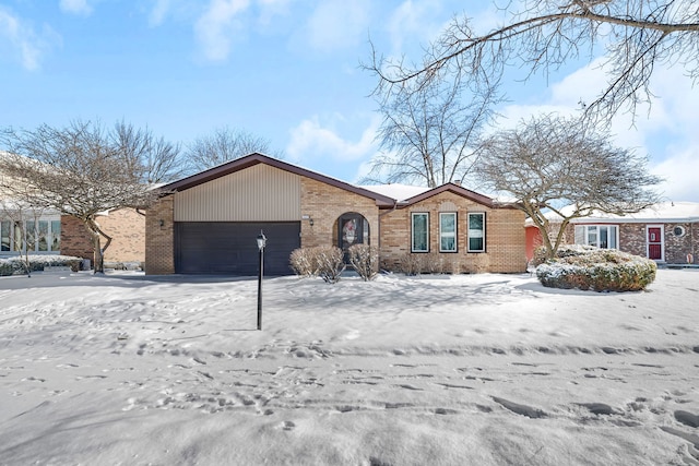 ranch-style house featuring a garage