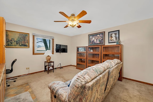 interior space with ceiling fan