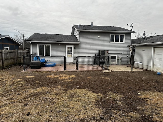 back of property with a patio