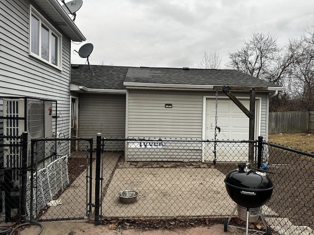 exterior space featuring area for grilling and a garage