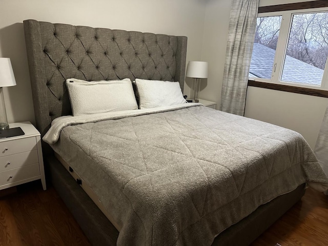 bedroom featuring dark wood-type flooring