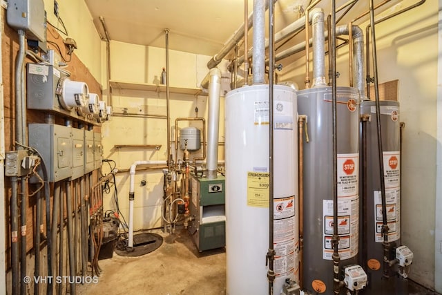 utility room with water heater and a heating unit