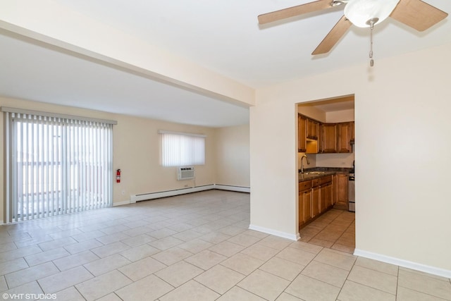 unfurnished living room featuring light tile patterned floors, sink, ceiling fan, a baseboard heating unit, and a wall unit AC