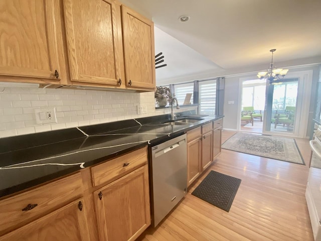 kitchen with light wood-style flooring, a sink, decorative backsplash, dishwasher, and a notable chandelier