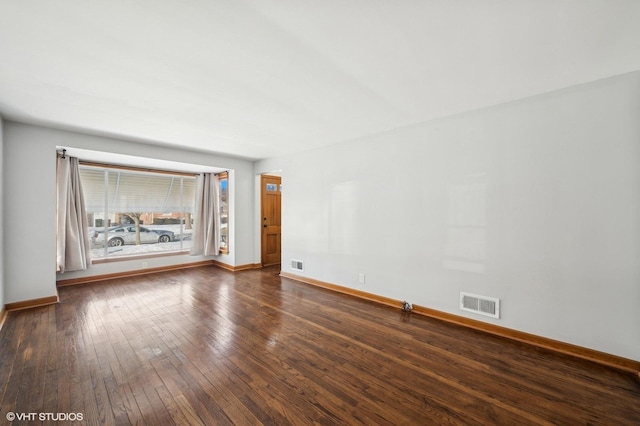 empty room featuring dark hardwood / wood-style floors