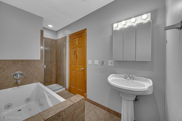 bathroom featuring shower with separate bathtub