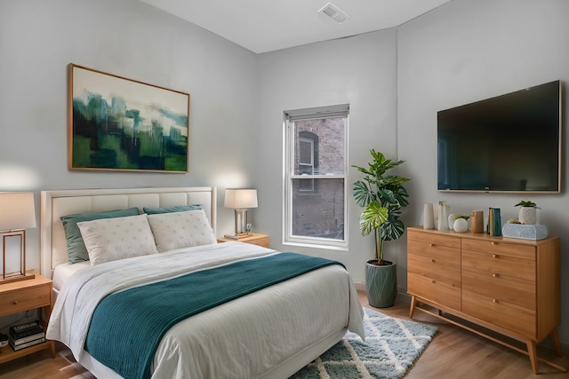 bedroom featuring hardwood / wood-style flooring