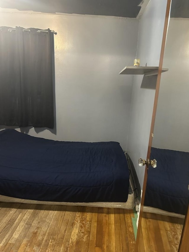 bedroom with wood-type flooring