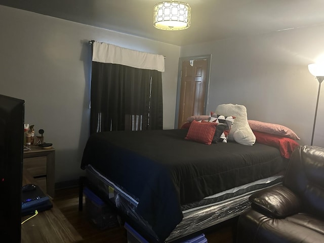 bedroom featuring dark hardwood / wood-style floors