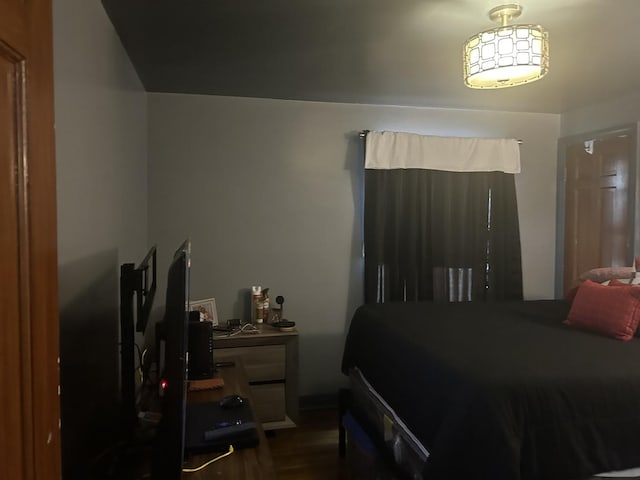 bedroom featuring dark hardwood / wood-style flooring