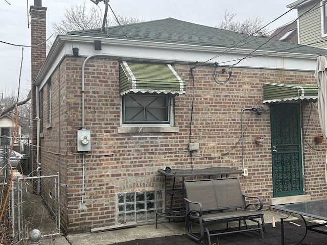 view of side of property featuring a patio